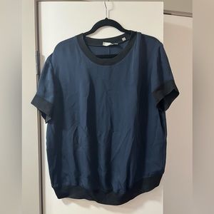 Navy silk blue Vince blouse with black trim. Size L
